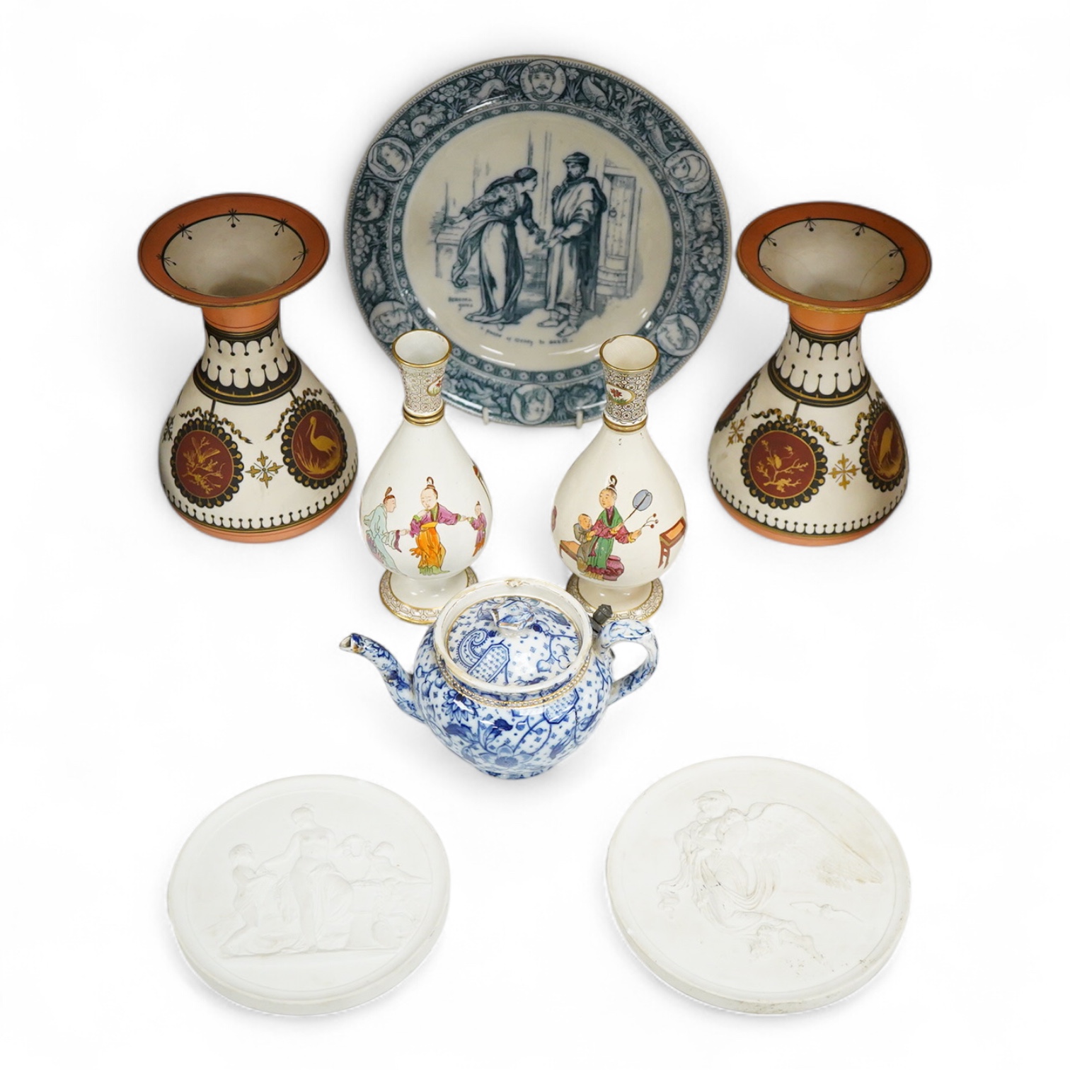A pair of Copenhagen biscuit relief plaques of Night and Day, after Thorvaldsen, 15cm diameter, plus two pairs of vases, a blue and white plate and teapot (8)